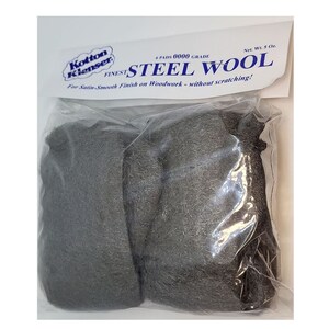 May include: A package of 0000 grade steel wool, labeled "Kotton Klenser Finest Steel Wool" and "For Satin Smooth Finish on Woodwork - without scratching!" The package contains four pads and weighs 5 oz.
