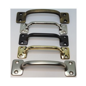 May include: Five cabinet pulls in different finishes: antique brass, nickel, black, polished brass, and satin nickel. Each pull has a rectangular shape with rounded edges and two holes for mounting.