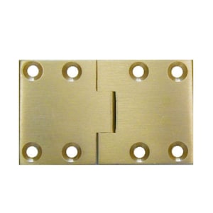 May include: Brass hinge with four holes on each side. The hinge is closed and ready to be installed.