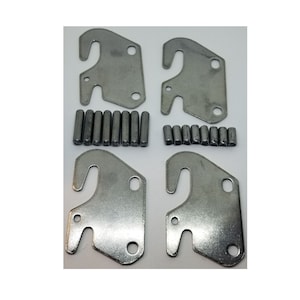 May include: Four silver metal furniture brackets with a hook design and a set of 16 silver metal pins.