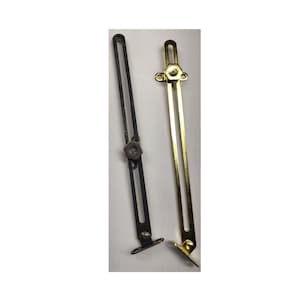 May include: Two metal window casement stays, one in a matte black finish and one in a polished brass finish. Each stay features a long slotted arm, a mounting bracket at the base, and a central adjustable knob for securing the window position.
