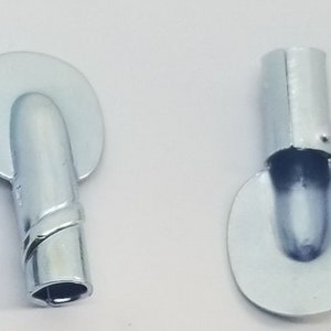 May include: Four silver metal hooks with a rounded head and a threaded shaft. The hooks are designed for hanging items.