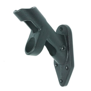 May include: Black metal bracket with two mounting holes and a curved arm with a round opening. The bracket is designed to hold a flagpole or other similar object.