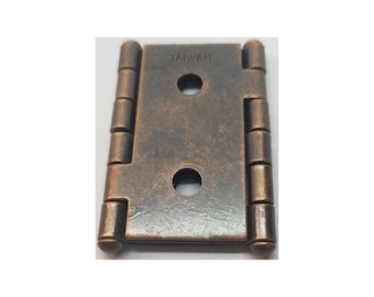 May include: Antique brass finish cabinet hinge with two round holes and the word "TAIWAN" stamped on the surface.