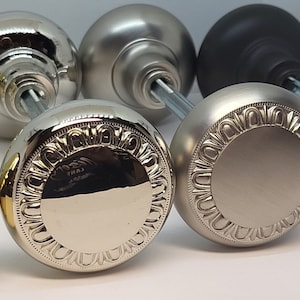 May include: Five door knobs in different finishes: polished brass, polished nickel, satin nickel, oil rubbed bronze, and black.