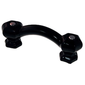 May include: Black ceramic cabinet pull with a curved shape and octagonal ends. The pull has a silver knob on each end.