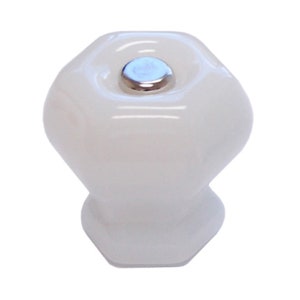 May include: White ceramic cabinet knob with a hexagonal shape and a silver metal screw.