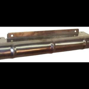 May include: A silver metal exhaust pipe cover with a ribbed design and a mounting bracket.