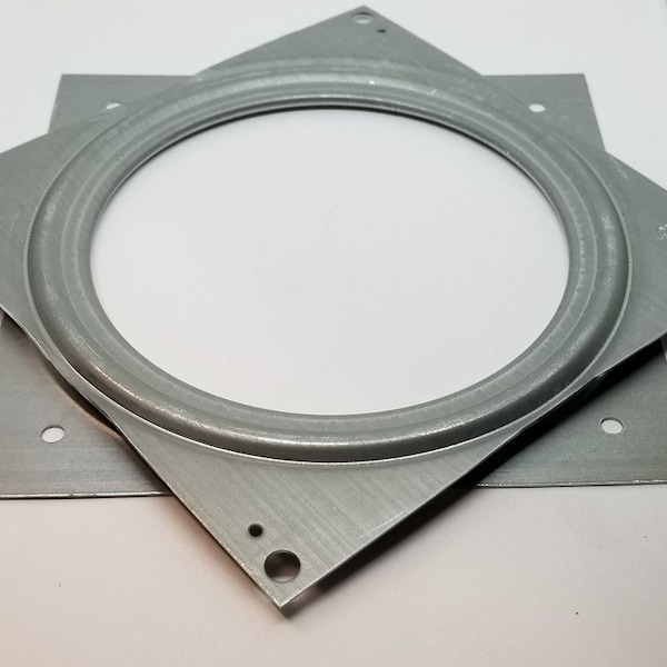 May include: A square metal swivel plate with four mounting holes. The plate has a circular groove for rotating a fixture.