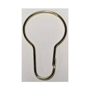 May include: A gold metal shower curtain ring with a rounded top and a hook on the bottom.
