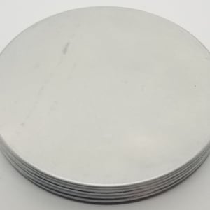 May include: A stack of six round, silver-colored metal discs.