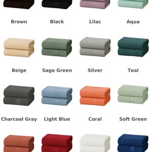 May include: A grid of sixteen folded rectangular towels in various colours including brown, black, lilac, aqua, beige, sage green, silver, teal, charcoal grey, light blue, coral, soft green, terra cotta, red, white, and dark blue with text labels.