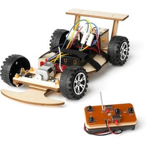 May include: A wooden DIY remote control car kit. The car features black tires, a wooden frame, and exposed wiring. A separate brown remote control with buttons and an antenna is included.