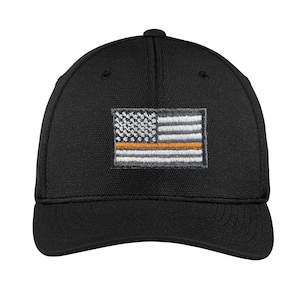 May include: Black baseball cap with an embroidered American flag with a thin orange stripe across the middle.