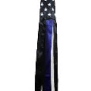 May include: A black and white American flag windsock with blue, white and black ribbons hanging from the bottom.