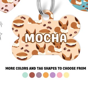May include: Three different dog tag designs featuring a cartoon Eevee with different names: Bubbles, Mocha, and Eevee. The tags are in the shapes of a heart, bone, and circle. The tags are on a white background with a few stars.