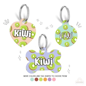 May include: Three different dog tag shapes with a kiwi fruit pattern. The tags are a heart, a circle, and a bone. Each tag has the name "Kiwi" printed on it. The tags are available in a variety of colors.