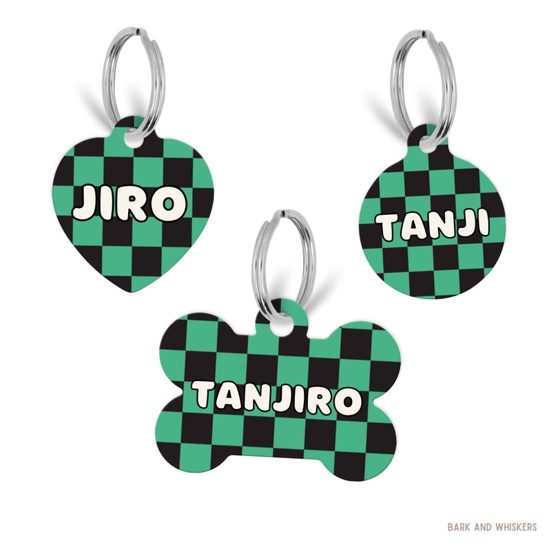 May include: Three pet ID tags with a green and black checkered pattern and silver split rings. One tag is heart-shaped with the name JIRO, one is circular with the name TANJI, and one is bone-shaped with the name TANJIRO. Text BARK AND WHISKERS is present.