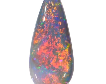 May include: A teardrop-shaped opal gemstone with a black base and a vibrant display of red, orange, green, and blue iridescent colors.