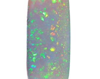 May include: A rectangular opal gemstone with a polished surface. The opal displays a play of color, with flashes of green, yellow, and orange against a milky white base. The stone is smooth and has rounded edges.