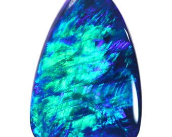 May include: A teardrop-shaped black opal gemstone with a blue and green iridescent sheen.