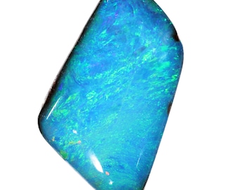May include: A vibrant blue opal gemstone with green and purple iridescence. The opal is cut into a rectangular shape with rounded edges.