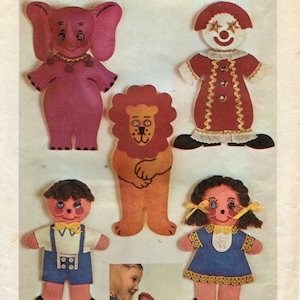 May include: Simplicity pattern number 9739, a transfer pattern for making five felt dolls. The dolls include a clown, an elephant, a lion, a boy, and a girl. The pattern is 85 cents in the U.S. and Canada.