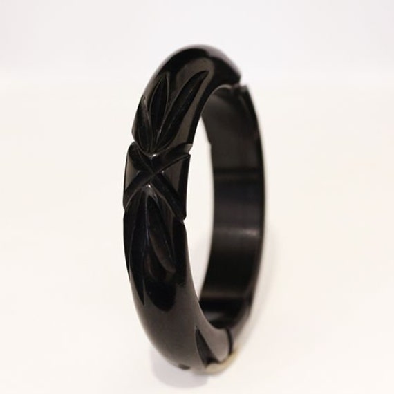 Deco era black Bakelite bangle with deep geometric