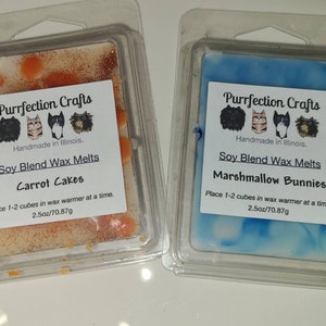 May include: Two soy blend wax melt packages. One is Carrot Cakes, with orange and white wax. The other is Marshmallow Bunnies, with blue and white wax. Both are 2.5oz/70.87g and from Purrfection Crafts.