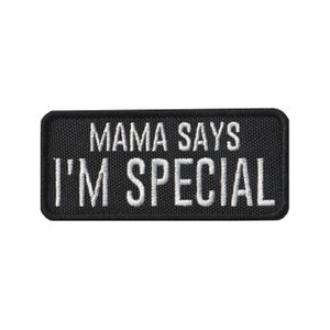 May include: Black embroidered patch with white text that reads "Mama Says I'm Special".