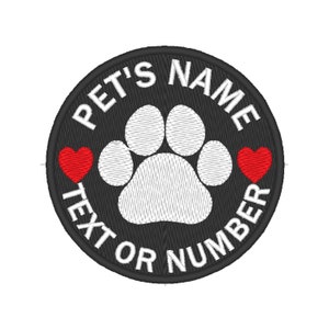 May include: Black and white paw print with two red hearts on either side. The text around the paw print reads "PET'S NAME TEXT OR NUMBER".