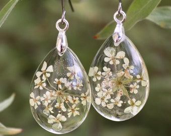 real flower earrings with delicate yellow blossoms (cow's parsley) in eco epoxy resin, teardrop shape, stainless steel earhooks