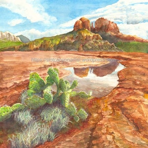 May include: Watercolor painting of a red rock landscape with a small pool of water reflecting the mountains. A prickly pear cactus grows in the foreground.