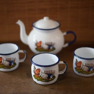 teapot and enameled mug