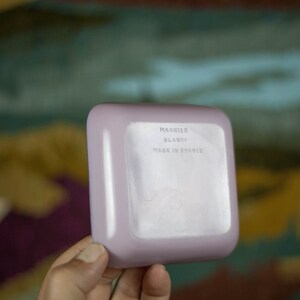 May include: A light purple square dish with the text "MAGNIER BLANZY MADE IN FRANCE" on the bottom.