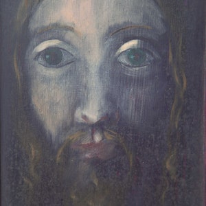 May include: A painting of a person with long, dark hair and a beard. The person has a light blue face with green eyes and a light pink mouth. The painting is on a dark background and has the signature "NIME 76" in the bottom right corner.