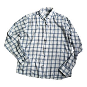 May include: A long-sleeved button-down shirt with a white and blue plaid pattern. The shirt has a classic collar, a chest pocket, and black buttons. The fabric appears to be lightweight.