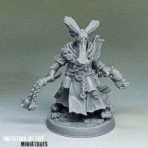 May include: A gray miniature figure of a robed character with a long beard, blindfold, and ornate headpiece. The figure holds a chain mace in one hand and has a mechanical gauntlet on the other. The base reads "IMITATION OF LIFE MINIATURES."