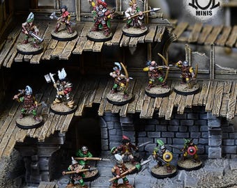 May include: Miniature figurines of fantasy characters, including archers, spearmen, and sword-wielding warriors. The figures are painted with detailed clothing and accessories, standing on a wooden structure and stone base. The figures are from the brand "IOL MINIS".
