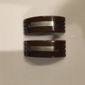 Brown Art Deco Carved Bakelite Shoe Clips