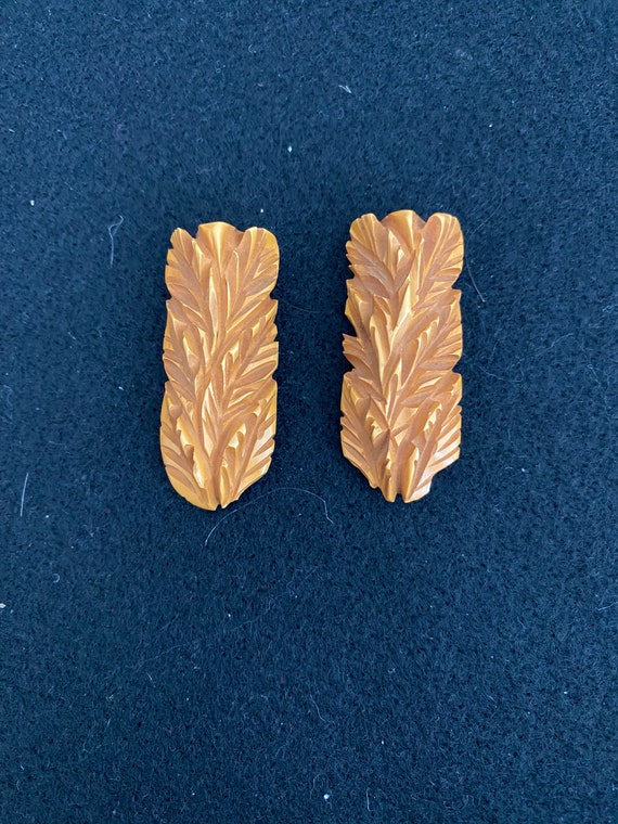 Intricately Carved Bakelite clips