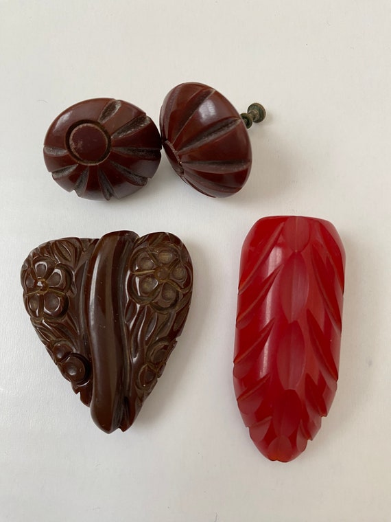 Bakelite brown clip and red clip carved with carve