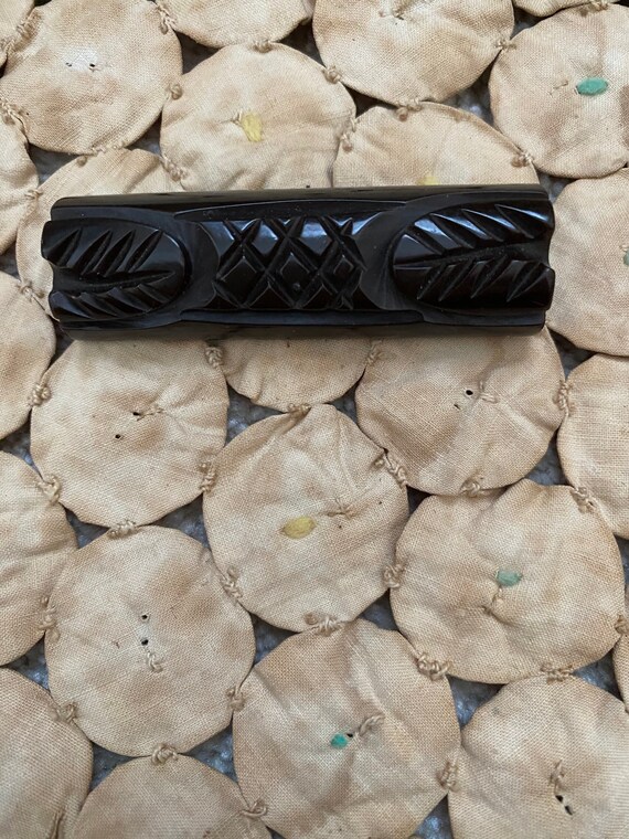 Deep brown carved Bakelite bar pin