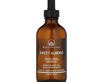 May include: A brown glass bottle with a dropper top filled with sweet almond oil. The label reads "Nature's Leaf Sweet Almond Prunis dulcis Organic Moisturizing Oil Huile Hydratante U.S.D.A. Certified Organic 118 ml / 4 fl oz."