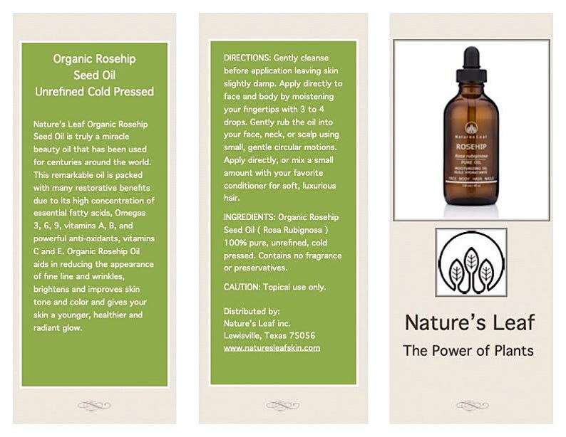 May include: A green and white label with the text "Nature's Leaf Organic Rosehip Seed Oil" and "The Power of Plants". A clear glass bottle with a brown cap and a green label with the text "Rosehip" is shown in the image. The bottle is sitting on a white surface.