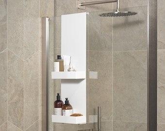 May include: A white vertical shower caddy with two rectangular shelves hanging over a glass shower door. The shelves hold various amber and clear plastic bottles with pump dispensers, a white tube, and a small brown textured sponge.
