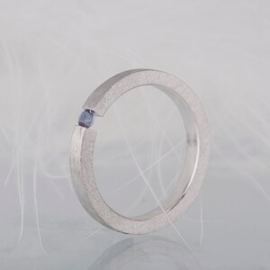 Sterling silver lab created alexandrite tension promise unisex ring