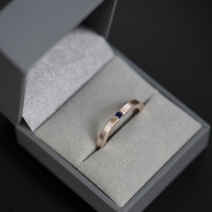 Mokume gane sterling silver and copper round natural blue sapphire tension engagement ring in a jewelry box