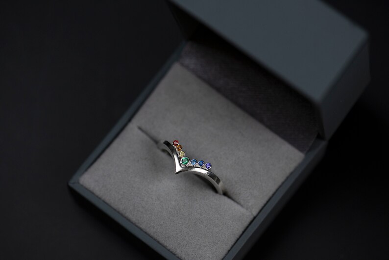 Sterling silver rainbow cubic zirconia enhancer chevron band in a jewelry box