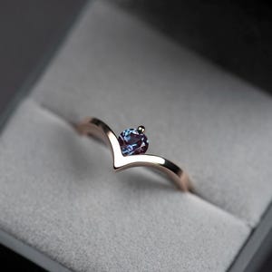 14K rose gold alexandrite chevron ring with accent diamond in a jewelry box